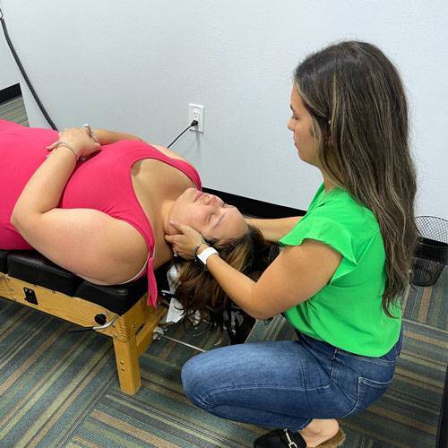 Chiropractor Palm Harbor FL Marialejandra Juliá With Patient Symptoms Headaches